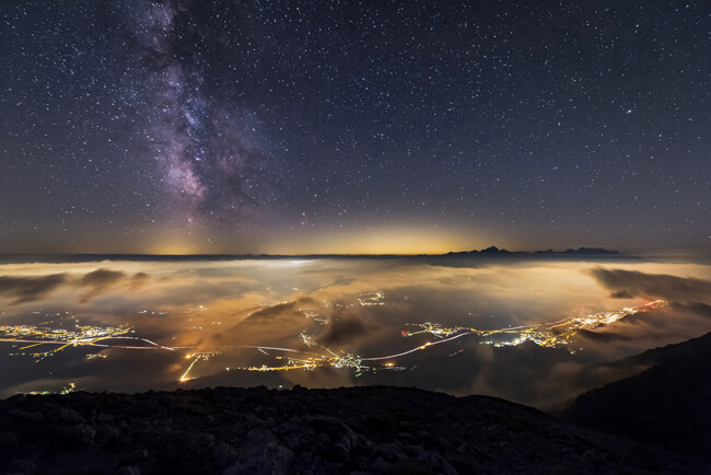 Milky way over Triglav and towns Jesenice and Bled